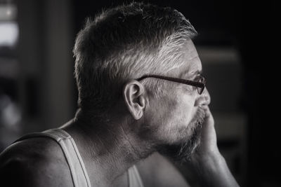 Close-up of thoughtful mature man at home