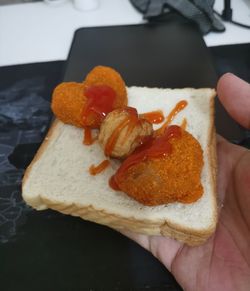 Close-up of hand holding bread