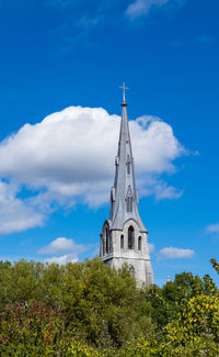 Low angle view of clock tower against sky