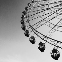 Low angle view of ferris wheel against sky