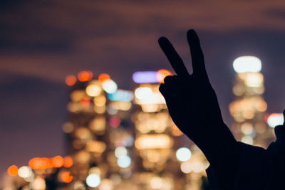 Defocused image of people at night