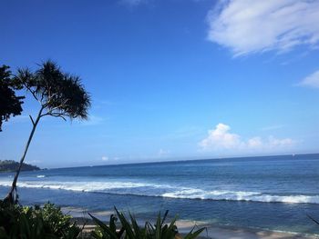 Scenic view of sea against blue sky