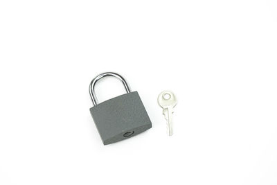 Close-up of padlock on white background