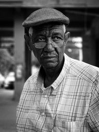 Portrait of old man wearing hat