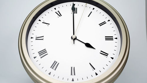 Close-up of clock on white background