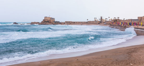 Panoramic view of beach against clear sky