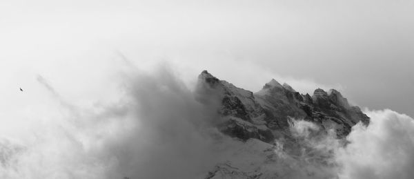 Panoramic view of snowcapped mountains against sky