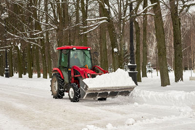 Bicycle parked on snow covered field