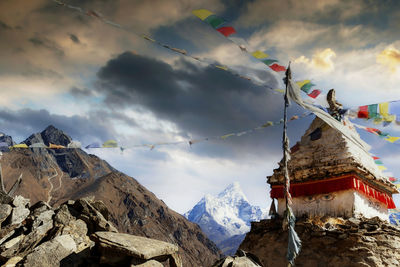 Prayer flags are blowing in the wind on the ama dablam in nepal
