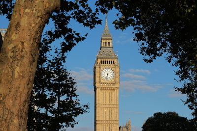 Low angle view of clock tower against sky