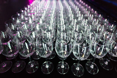 Close-up of glass bottles against black background