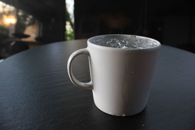 Close-up of coffee cup on table