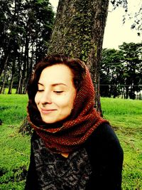 Portrait of smiling young woman in park