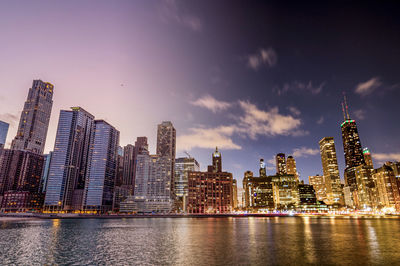 Illuminated buildings in city at night