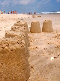 Sandcastle at beach during summer