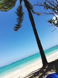 Scenic view of calm sea against blue sky