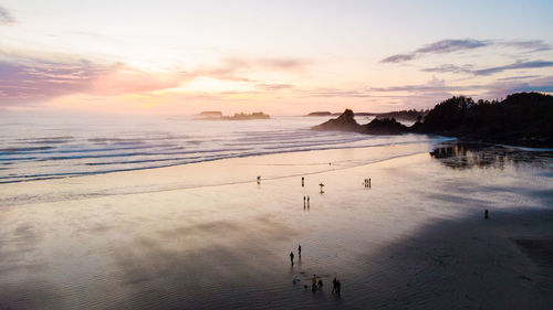 Scenic view of beach against sky during sunset