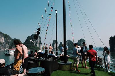 People standing against clear sky