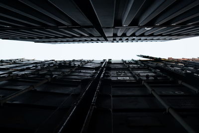 Low angle view of interval space between containers.