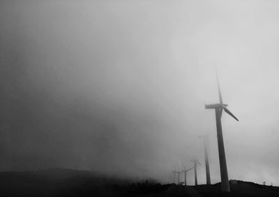 Low angle view of wind turbine against sky