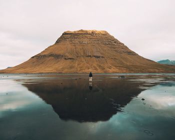 View of beach against cloudy sky