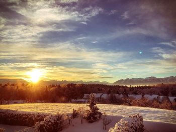 Scenic view of landscape against sky during sunset