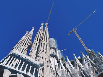 Low angle view of building against blue sky