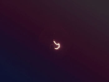 Low angle view of moon against sky at night