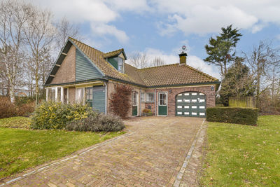 House on field against sky