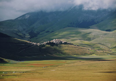Scenic view of agricultural landscape against sky