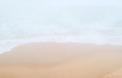 Close-up of sand against sky