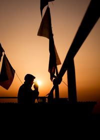 Silhouette of people at sunset