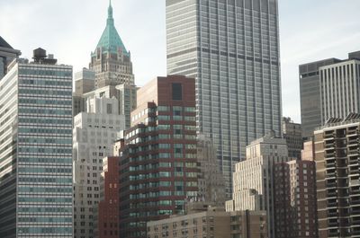 Low angle view of buildings in city against sky