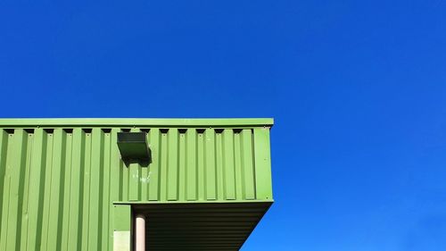 Low angle view of building against blue sky