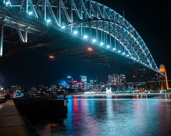 Illuminated city at night harbour bridge 
