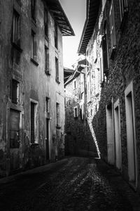 Narrow alley amidst buildings in city