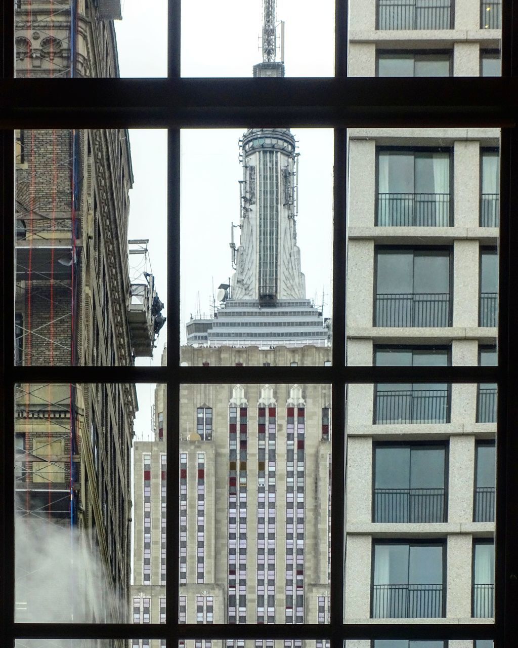 REFLECTION OF BUILDINGS ON GLASS