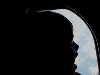 Close-up of woman against clear sky