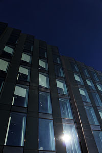 Low angle view of modern building against clear sky