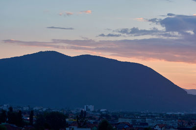 Scenic view of mountains against sky at sunset