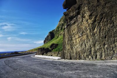 Road by sea against sky