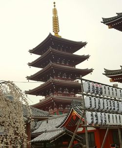 Low angle view of pagoda against sky in city
