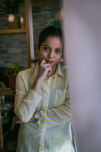 Portrait of young woman standing