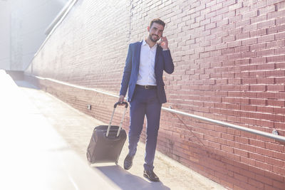 Businessman with suitcase taking a business trip