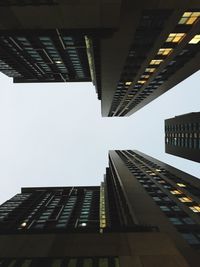 Low angle view of modern buildings against clear sky