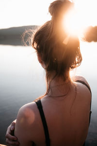 Rear view of woman looking away