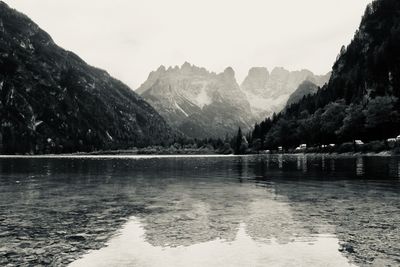 Scenic view of lake and mountains against sky