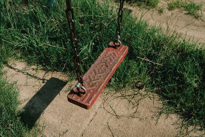 High angle view of slide on grassy field