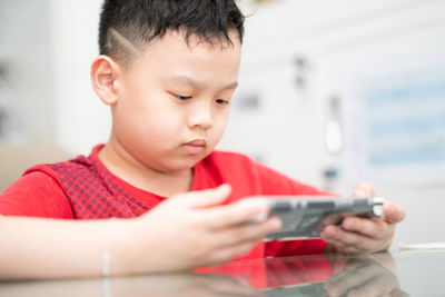 Child plays game console for fun