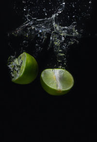 Close-up of fruits against black background